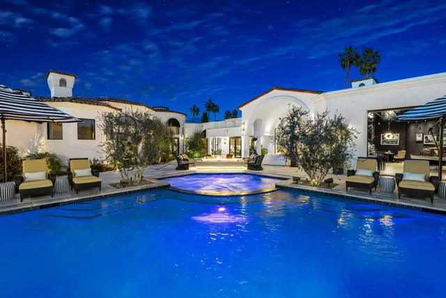 a bathroom with a sink a mirror and a shower