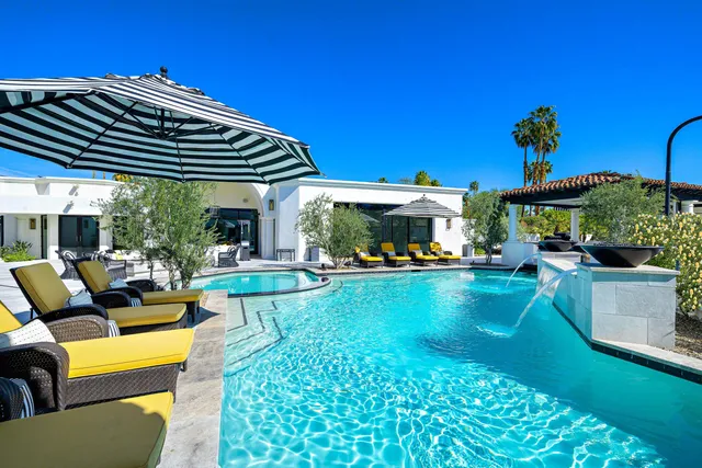 a bedroom with bed and wooden floor