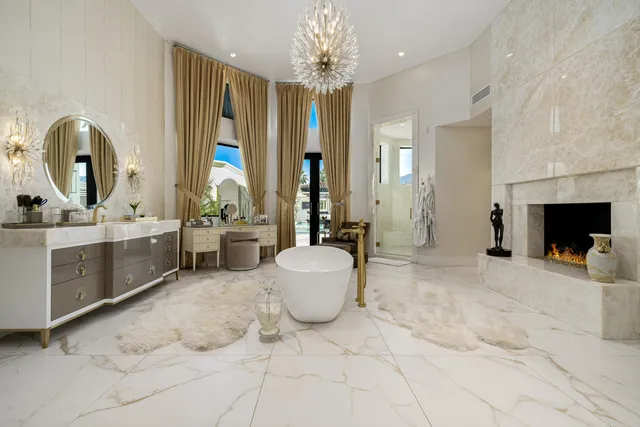 a kitchen with stainless steel appliances granite countertop a refrigerator and a stove