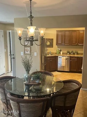 a kitchen with table and chairs
