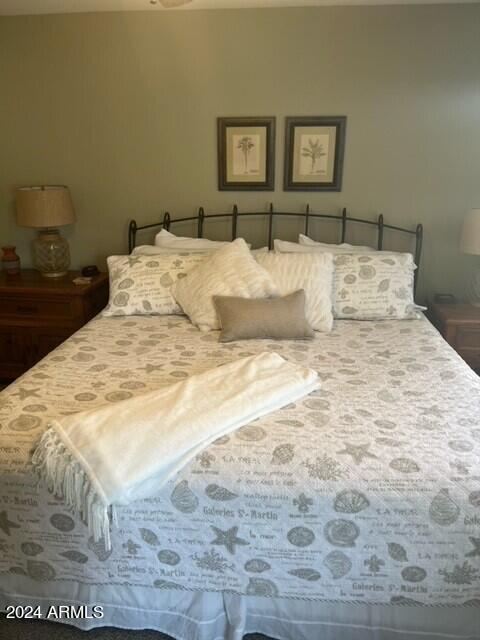 8700 East Mountain View Road, Unit 1058 Scottsdale, AZ 85258 - Photo 15 of 31 a bedroom with a bed and a night stand