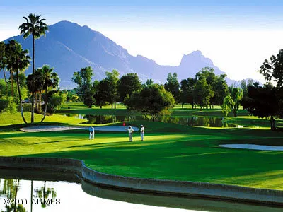 a view of a golf course with a lake