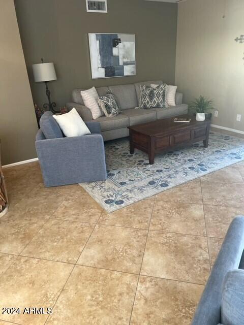 8700 East Mountain View Road, Unit 1058 Scottsdale, AZ 85258 - Photo 5 of 31 a living room with furniture and a rug