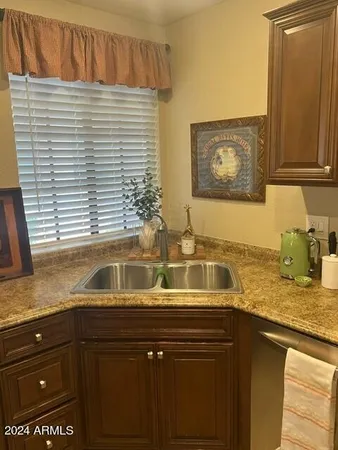 a kitchen with a sink and cabinets