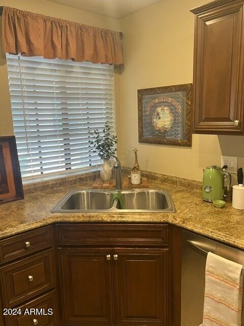 8700 East Mountain View Road, Unit 1058 Scottsdale, AZ 85258 - Photo 9 of 31 a kitchen with a sink and cabinets