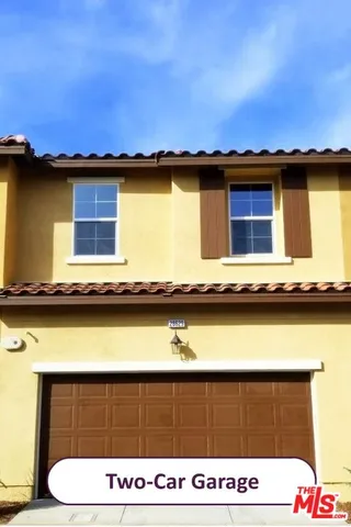 a view of outdoor space with signage and flags