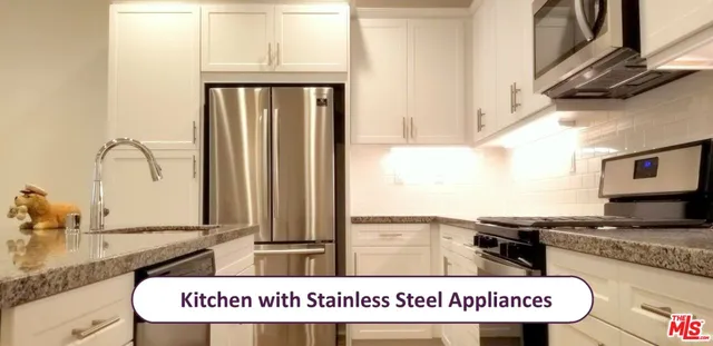 a view of a kitchen with granite countertop a sink and a stove
