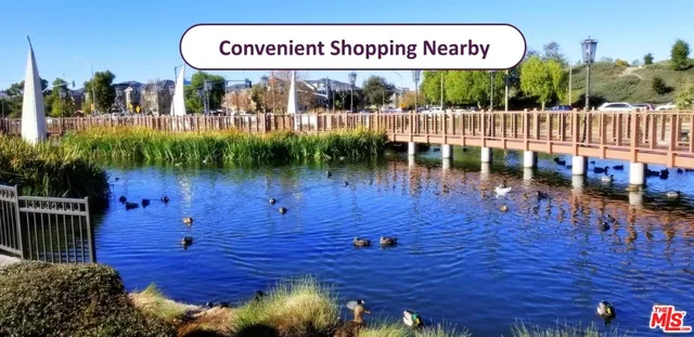 a view of living room with furniture and a fireplace