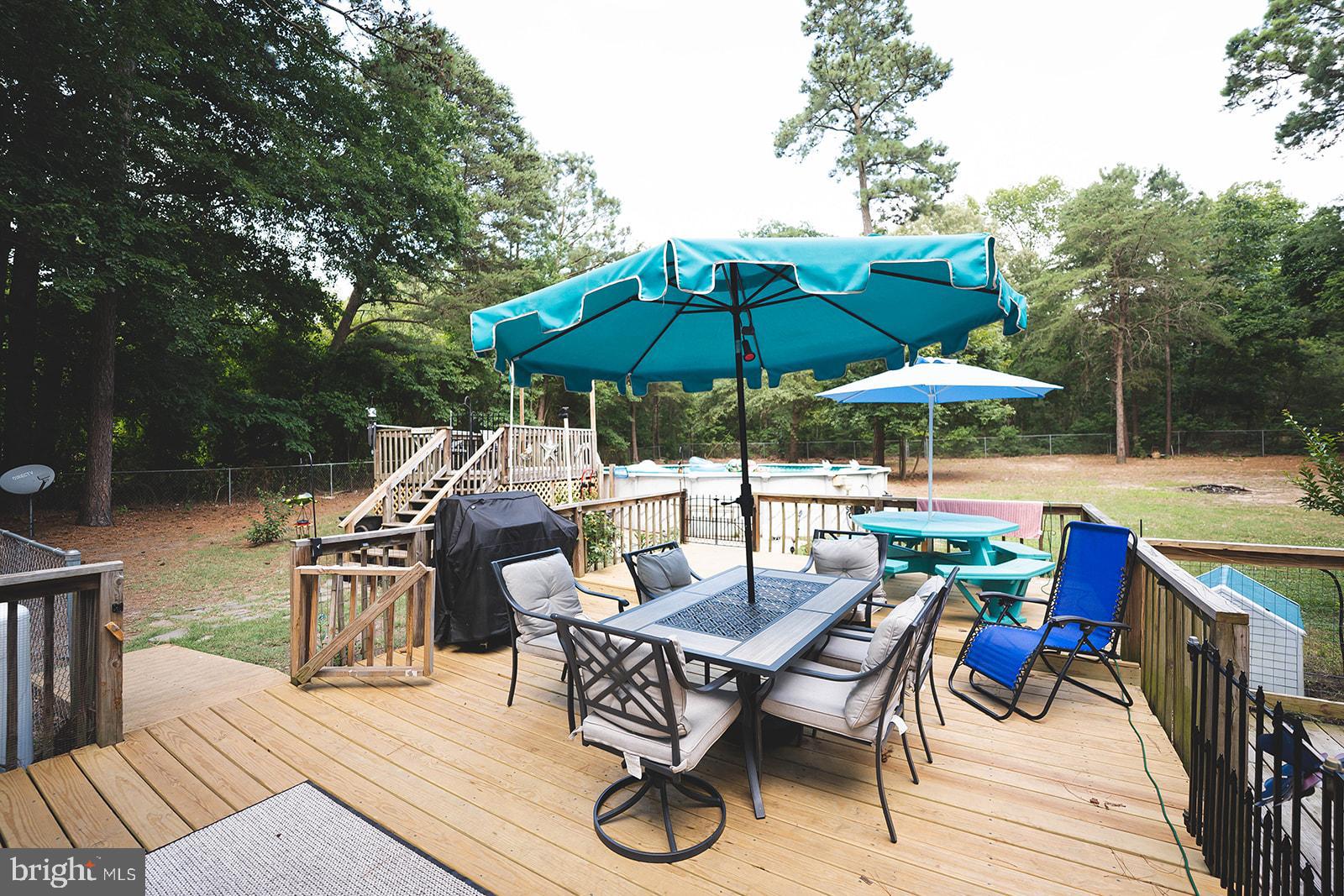 21831 Wetipquin Road Quantico, MD 21856 - Photo 3 of 57 a view of backyard with outdoor seating and trees