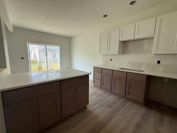 a kitchen with sink and cabinets