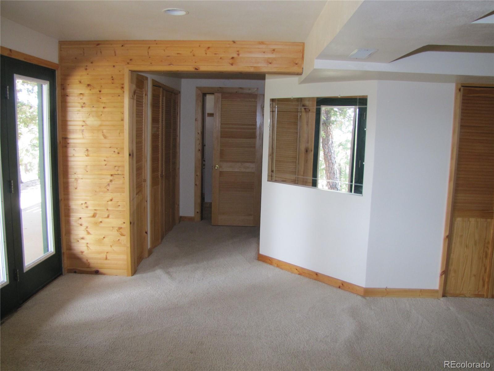 1240 Campfire Road Hartsel, CO 80449 - Photo 20 of 25 an empty room with windows