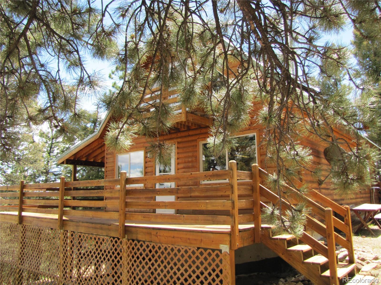 1240 Campfire Road Hartsel, CO 80449 - Photo 24 of 25 a view of a house with a tree