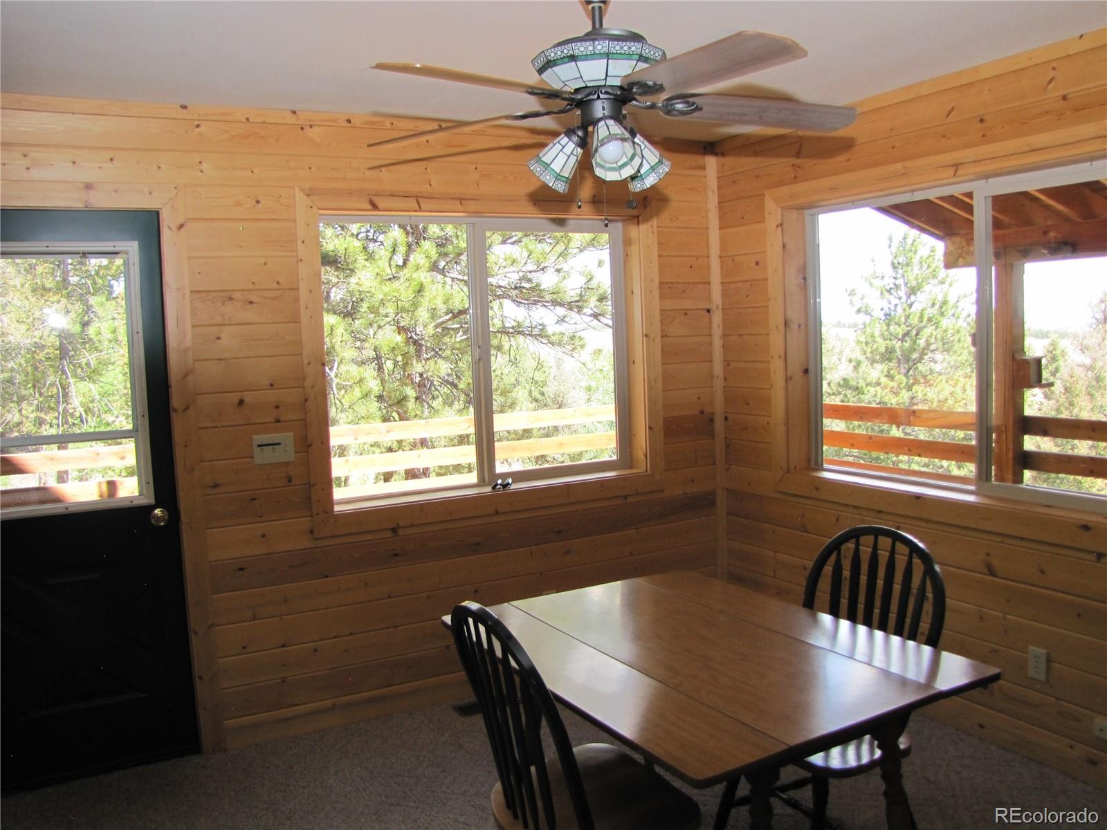 1240 Campfire Road Hartsel, CO 80449 - Photo 10 of 25 a view of a dining room with furniture window and outside view