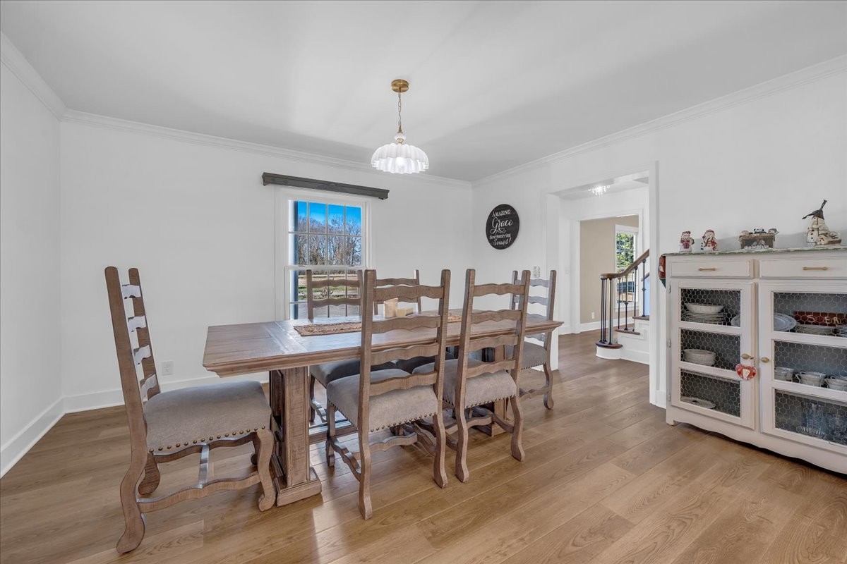 251 Miller Road Hillsboro, TN 37342 - Photo 24 of 80 a view of a dining room with furniture and wooden floor