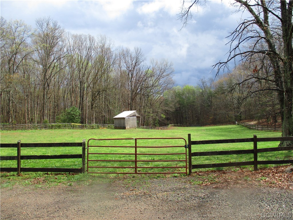 3813 Forest Grove Road Sandy Hook, VA 23153 - Photo 3 of 8 a green field with trees in the background
