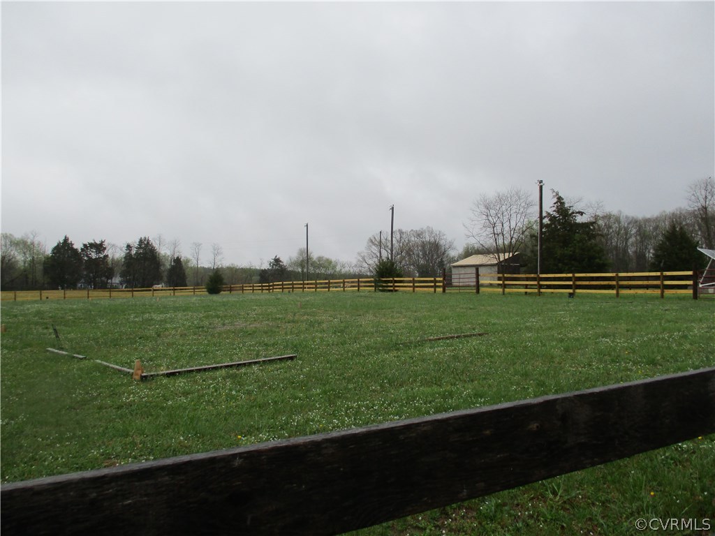 3813 Forest Grove Road Sandy Hook, VA 23153 - Photo 4 of 8 a view of a field of grass and trees