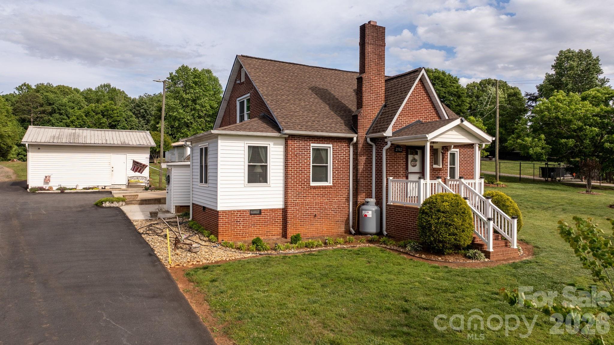 a front view of a house with garden
