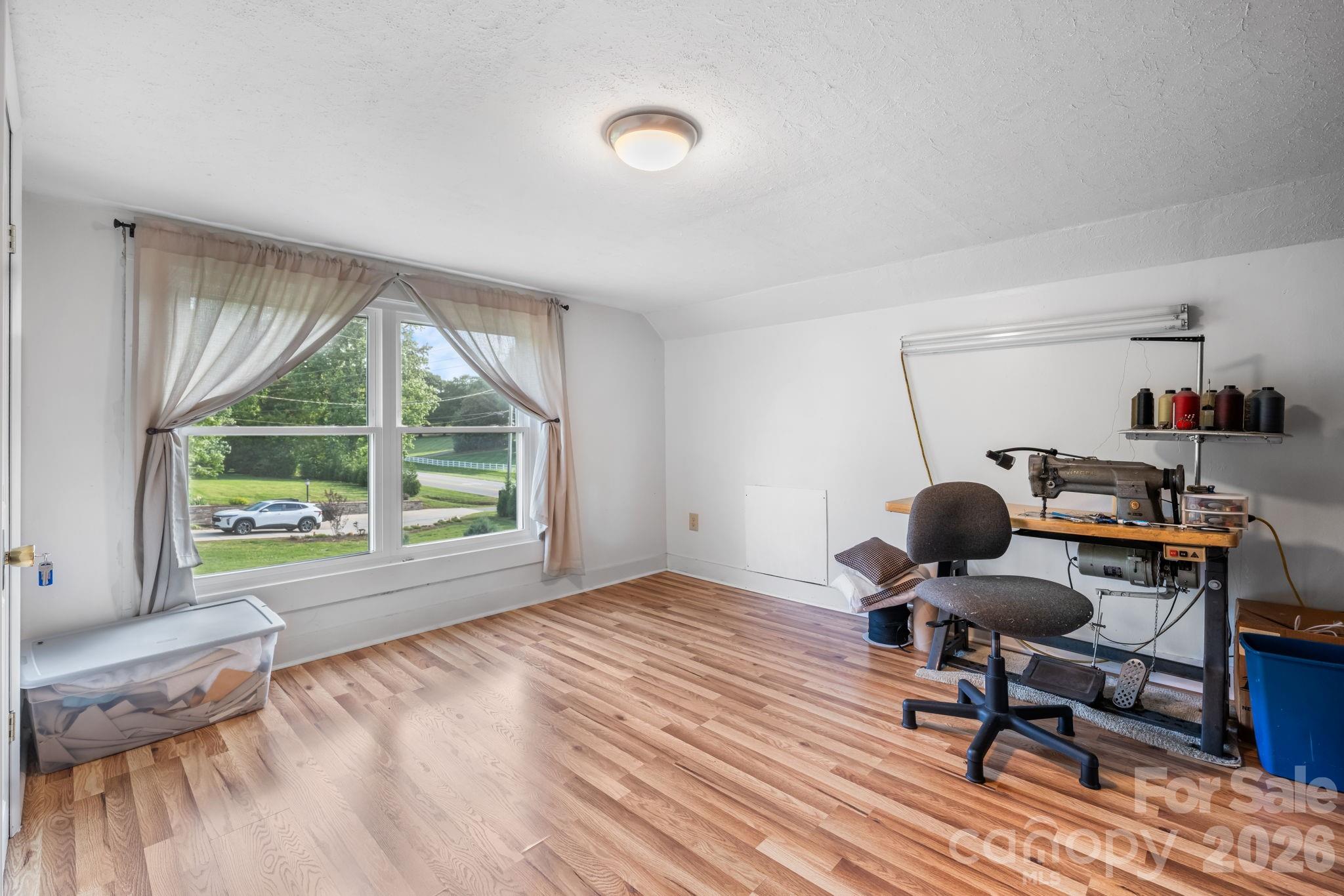 2582 Startown Road Newton, NC 28658 - Photo 19 of 42 a workspace with furniture and a window