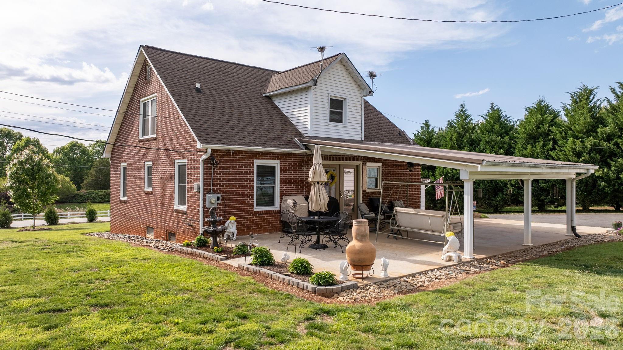 2582 Startown Road Newton, NC 28658 - Photo 20 of 42 a front view of house with yard patio and green space