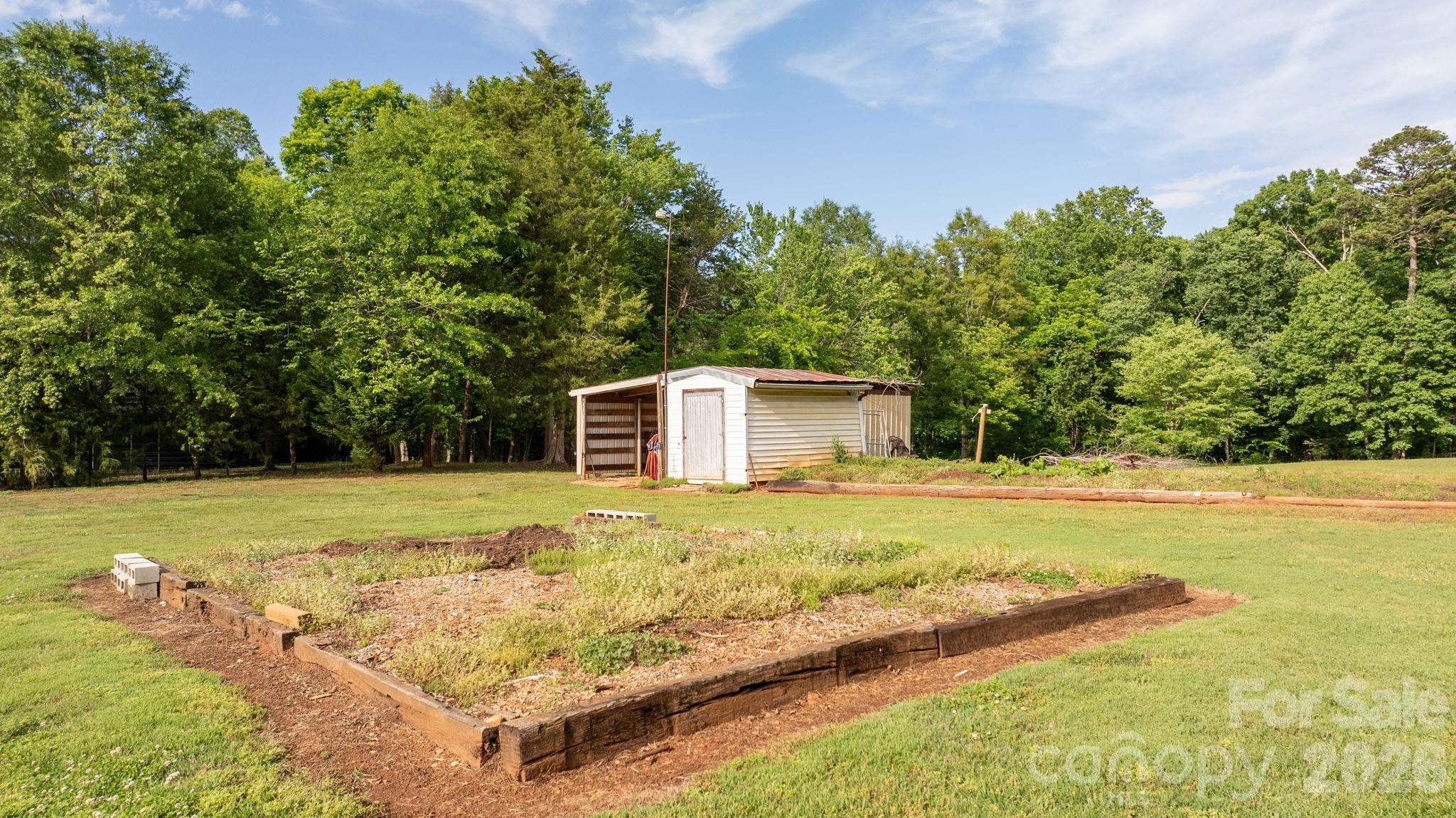 2582 Startown Road Newton, NC 28658 - Photo 29 of 42 a view of a large yard with large trees and a small yard
