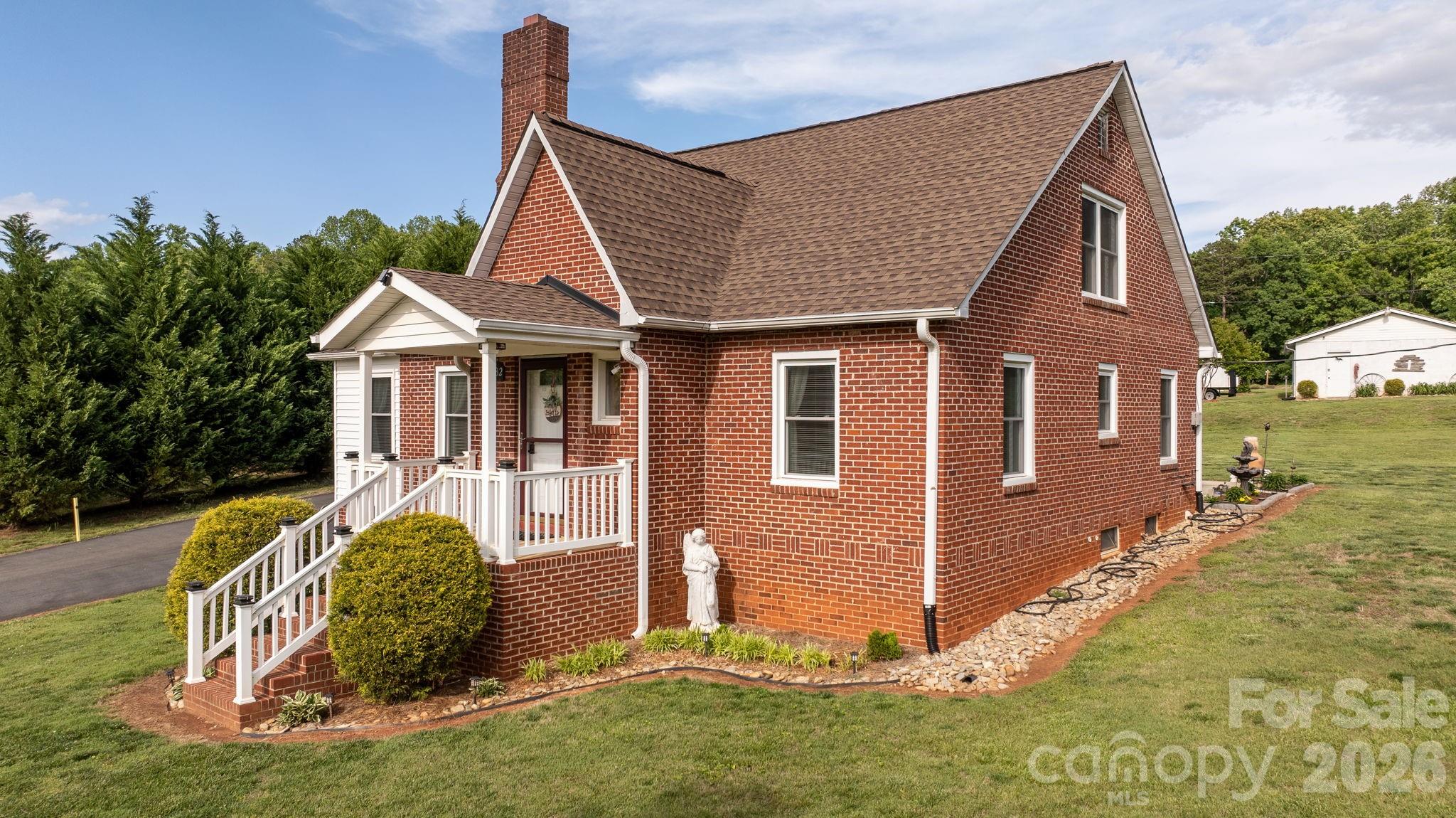 2582 Startown Road Newton, NC 28658 - Photo 3 of 42 a front view of a house with a yard