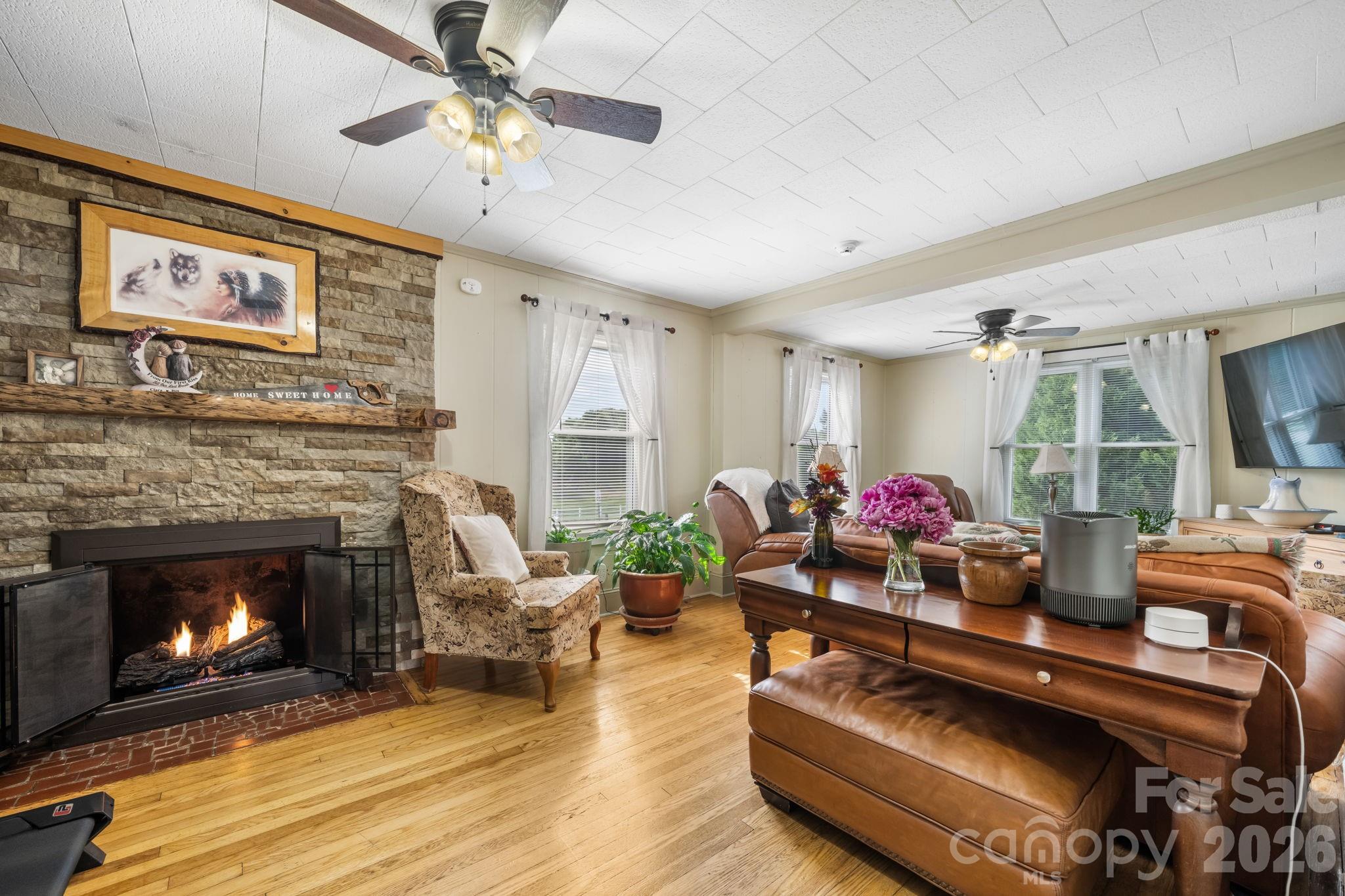 2582 Startown Road Newton, NC 28658 - Photo 4 of 42 a living room with furniture and a fireplace