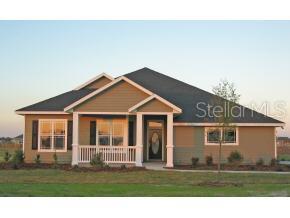 10064 Southwest 98th Lane Gainesville, FL 32608 - Photo 1 of 1 a front view of a house with a garden