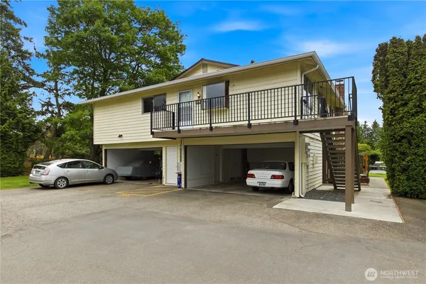 a view of a cars park in front of house