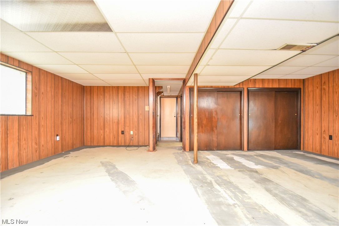 47700 Summerset Road East Liverpool, OH 43920 - Photo 25 of 35 Basement with a paneled ceiling and wooden walls