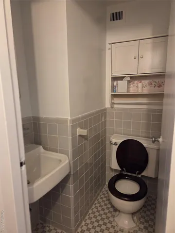 a bathroom with a toilet and a sink