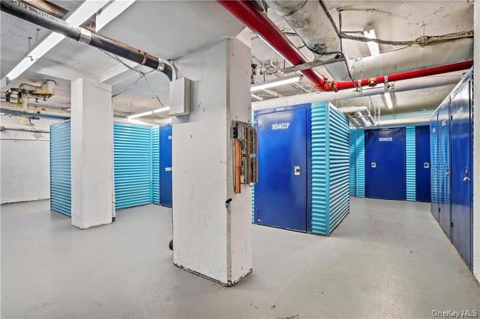 7 Fordham Hill Ovl, Unit 12G Bronx, NY 10468 - Photo 16 of 18 a view of a room with stairs and a chandelier