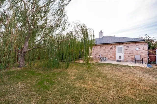 a backyard of a house with lots of green space