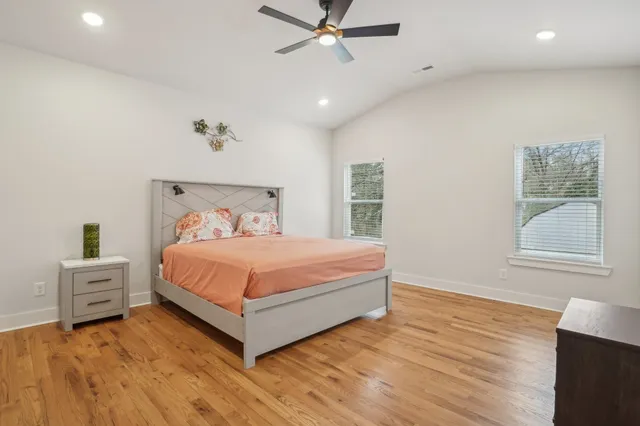 a bedroom with a bed and window