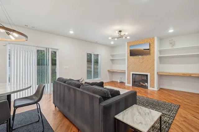 a living room with furniture and a fireplace