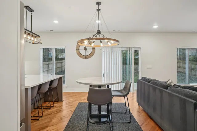 a room with furniture a window and a chandelier