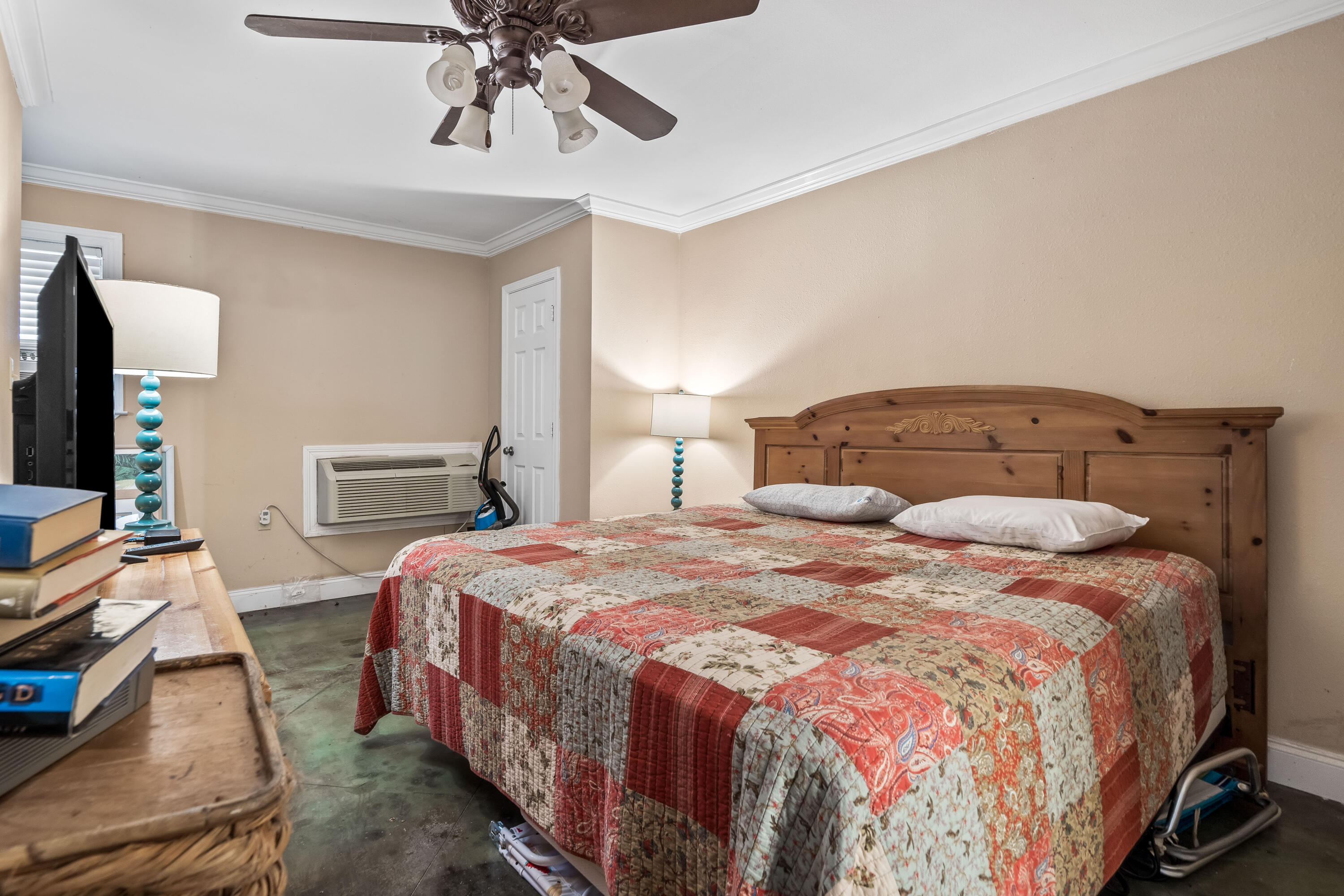 200 Beach Drive West Miramar Beach, FL 32550 - Photo 11 of 45 a bedroom with a bed and a chandelier