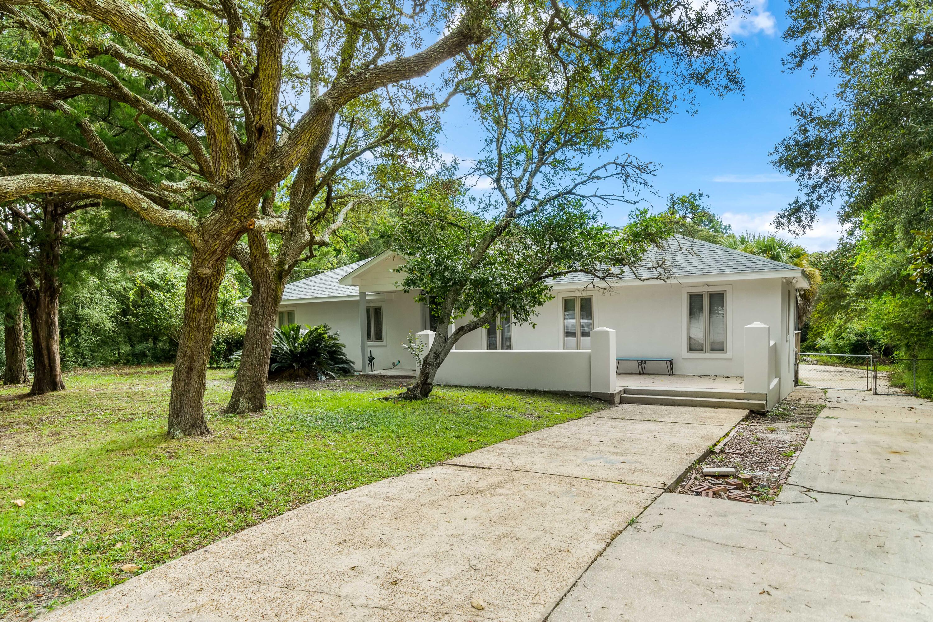 200 Beach Drive West Miramar Beach, FL 32550 - Photo 2 of 45 front view of a house with a yard
