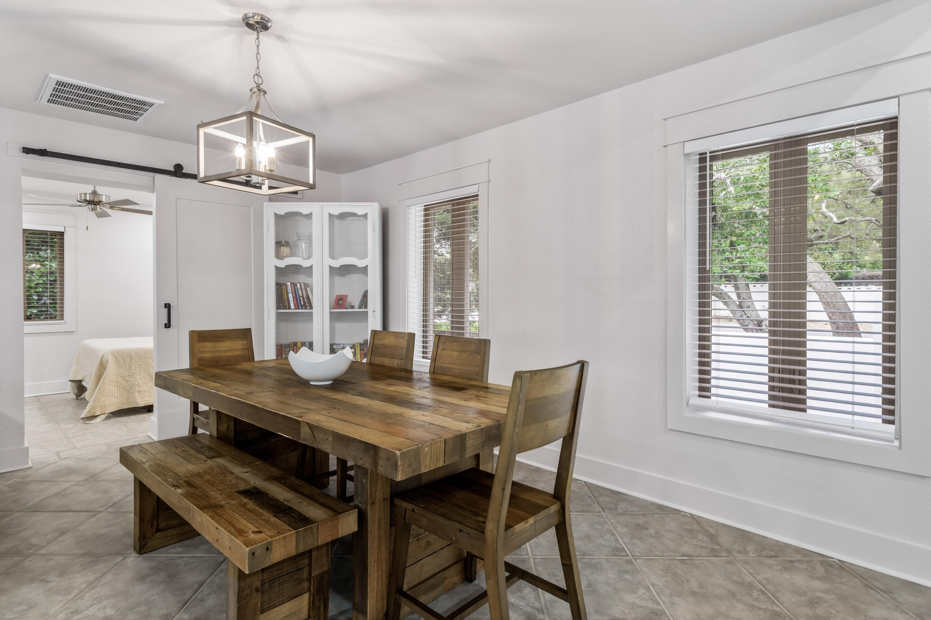 200 Beach Drive West Miramar Beach, FL 32550 - Photo 25 of 45 a view of a dining room with furniture window and wooden floor