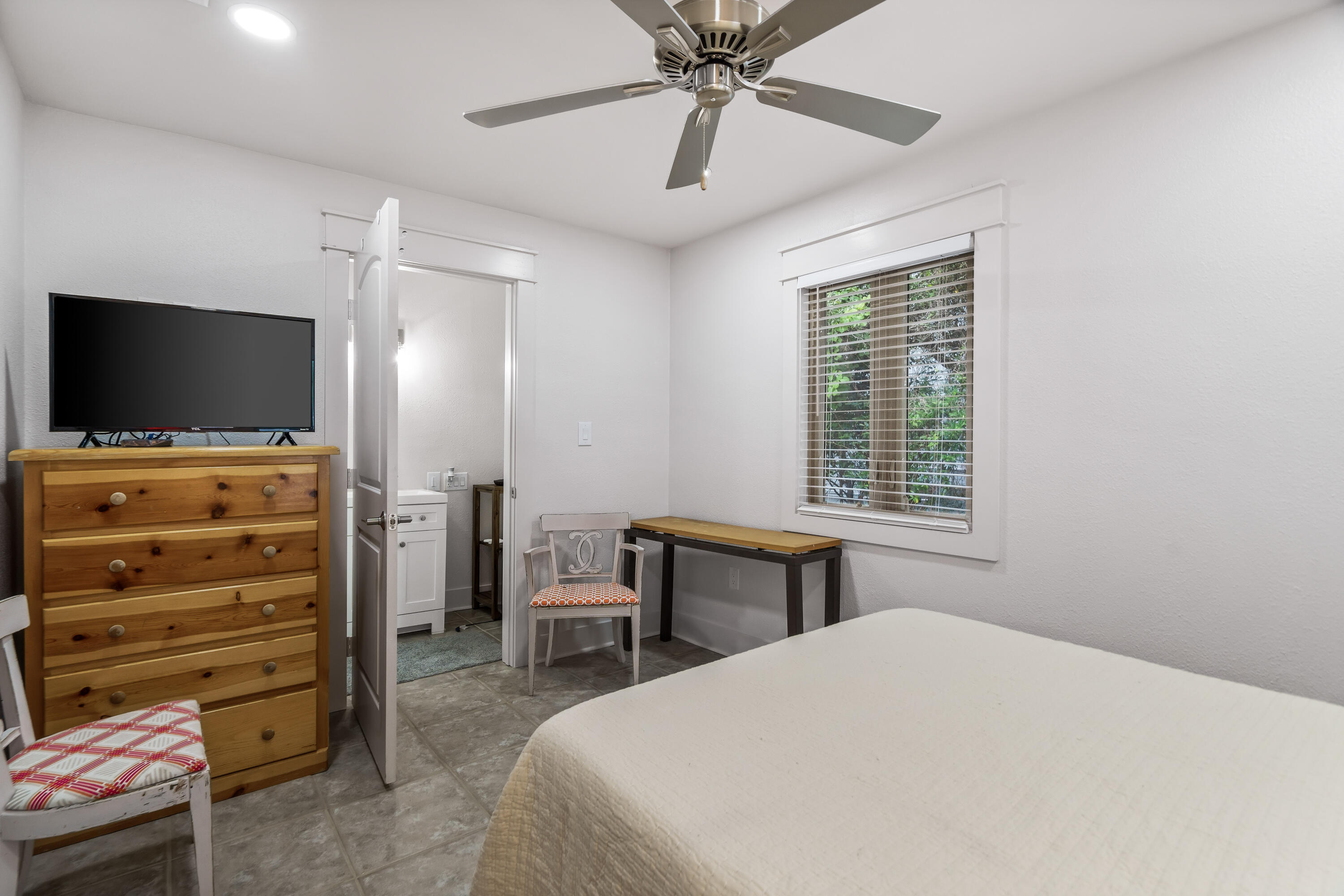 200 Beach Drive West Miramar Beach, FL 32550 - Photo 28 of 45 a bedroom with a bed and a flat screen tv