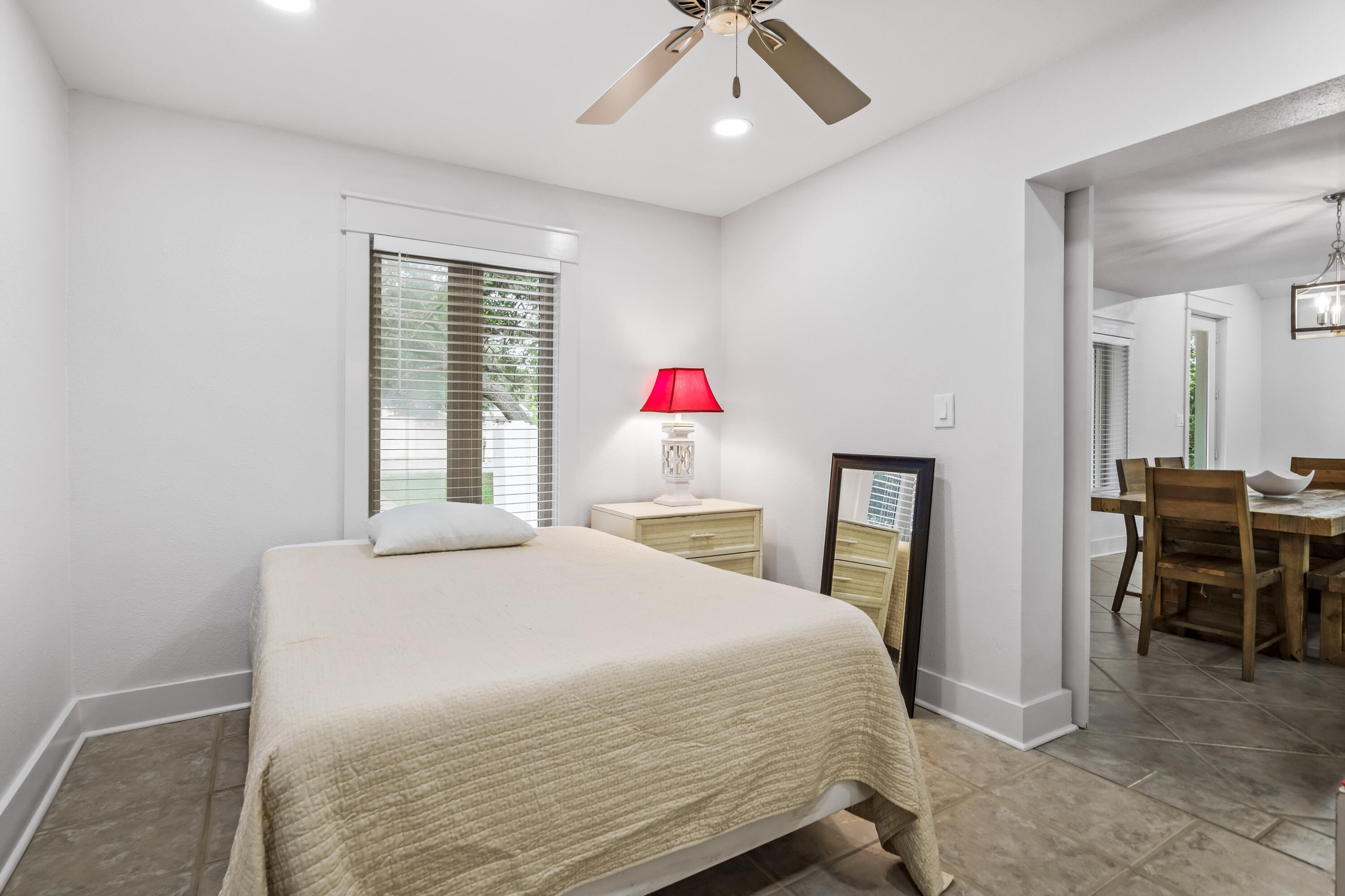 200 Beach Drive West Miramar Beach, FL 32550 - Photo 30 of 45 a bedroom with a bed and a table