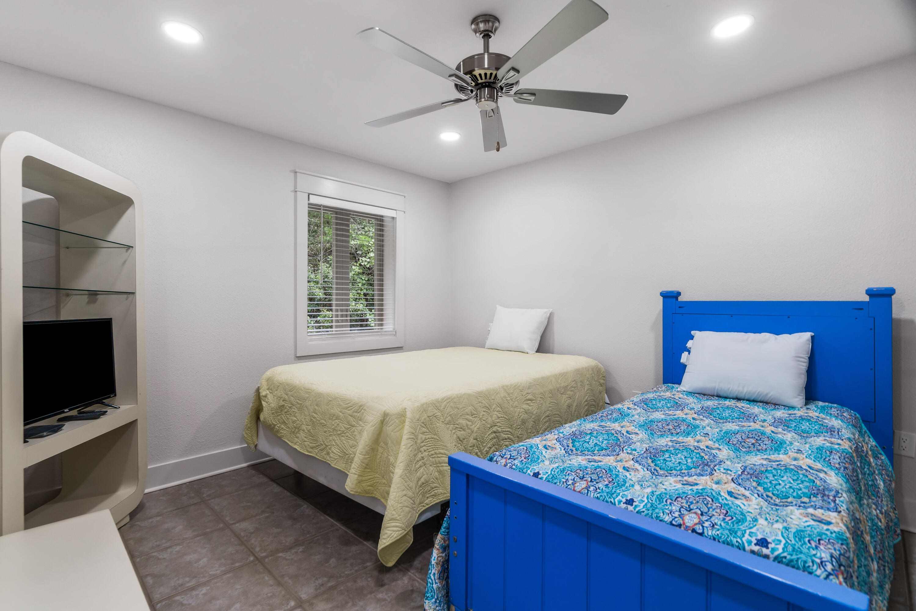 200 Beach Drive West Miramar Beach, FL 32550 - Photo 33 of 45 a bedroom with two beds and a television