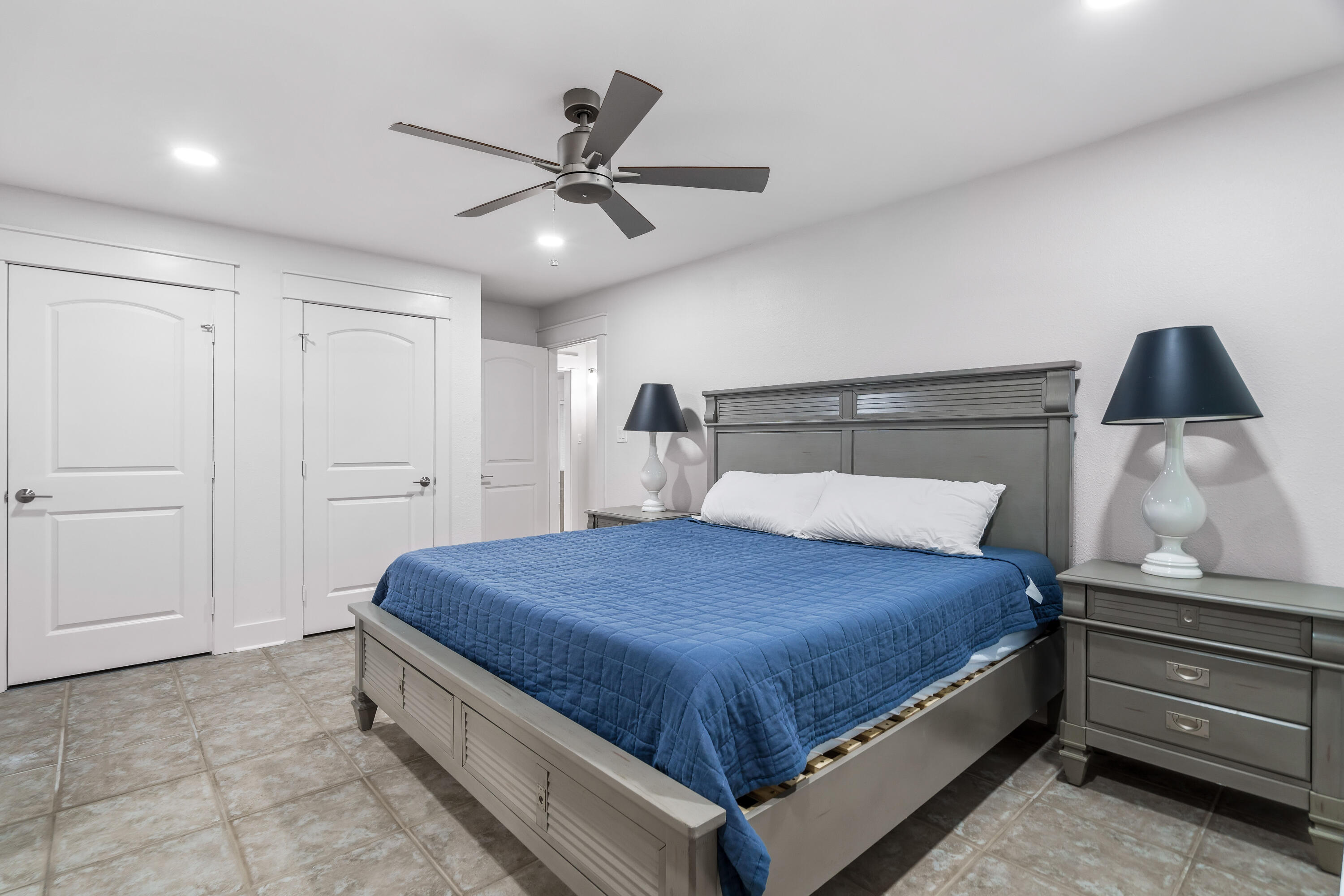 200 Beach Drive West Miramar Beach, FL 32550 - Photo 40 of 45 a bedroom with a bed and cabinet