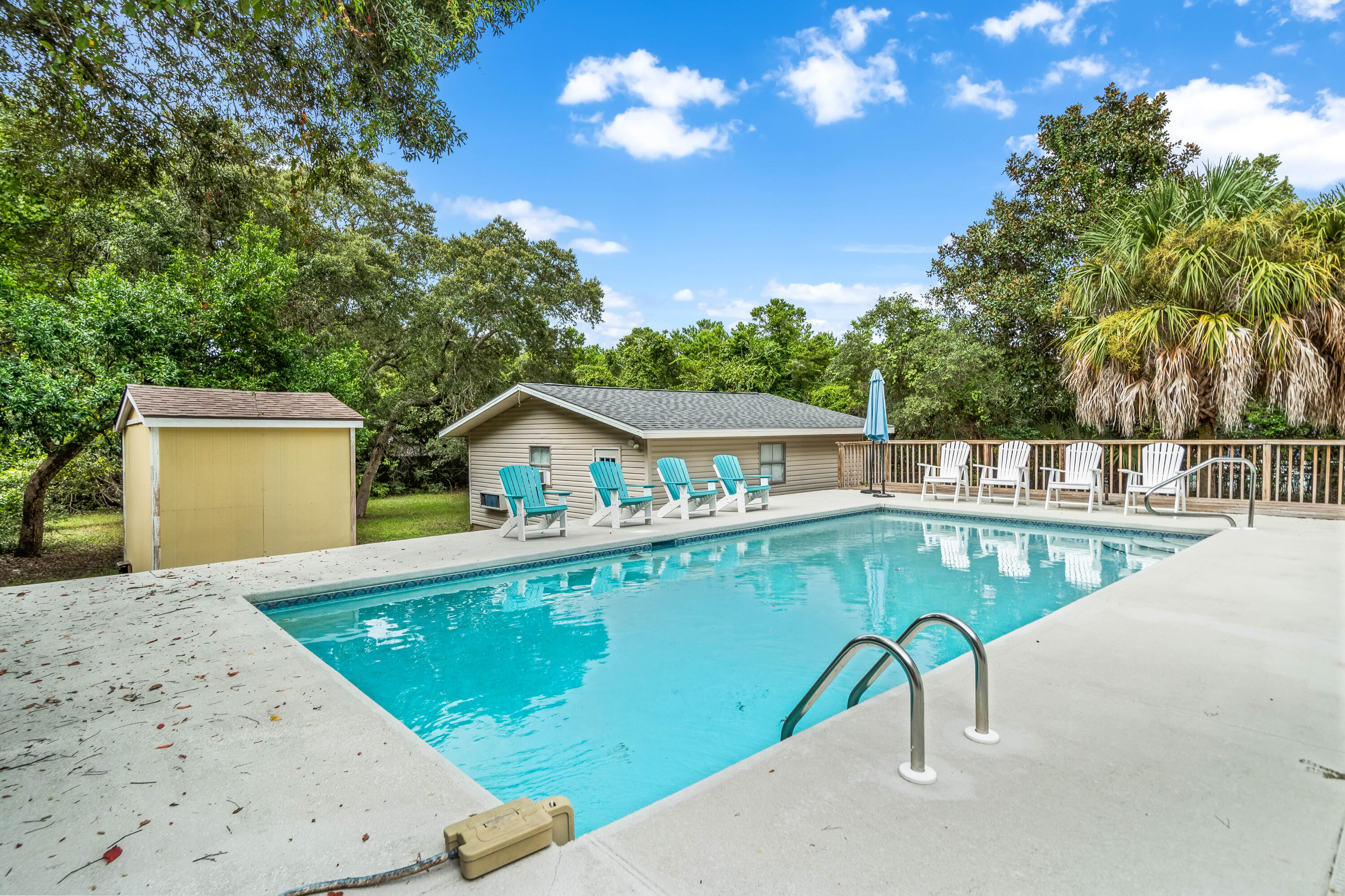 200 Beach Drive West Miramar Beach, FL 32550 - Photo 7 of 45 a view of a swimming pool with a patio and a yard