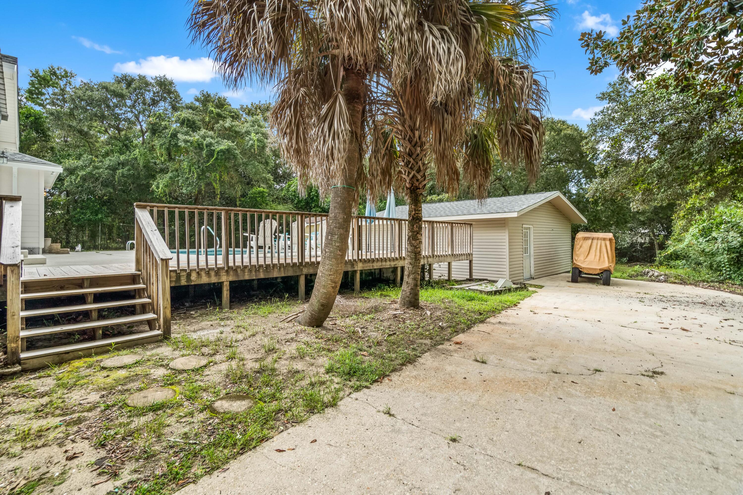 200 Beach Drive West Miramar Beach, FL 32550 - Photo 9 of 45 a view of a house with backyard and a tree