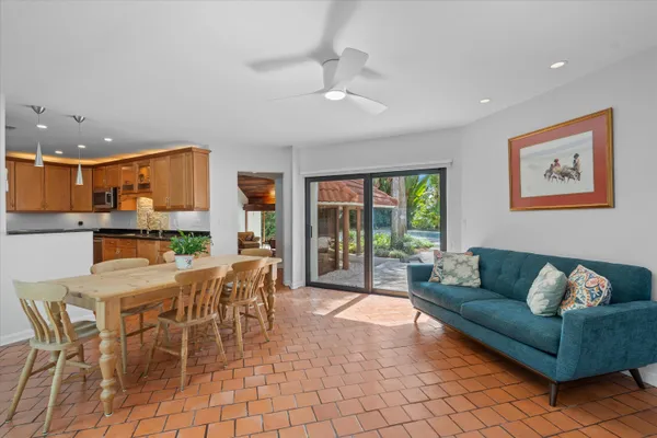 a kitchen with stainless steel appliances granite countertop a refrigerator a sink and a stove