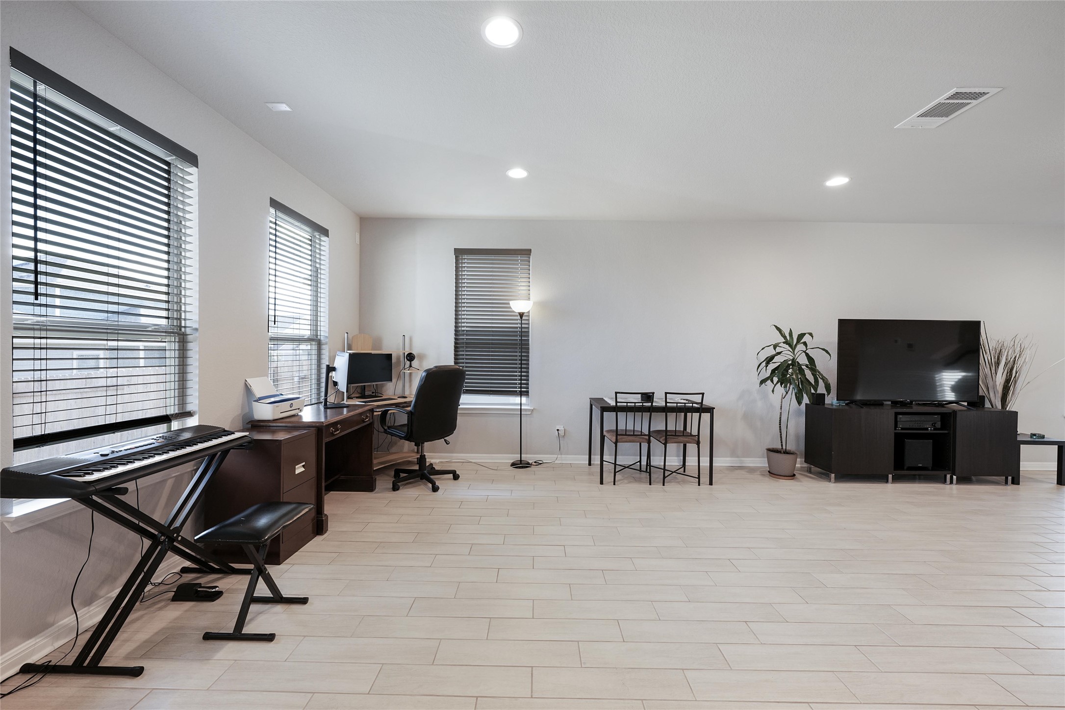 108 Drifter Lane Jarrell, TX 76537 - Photo 3 of 12 Home office with recessed lighting and wood finish floors