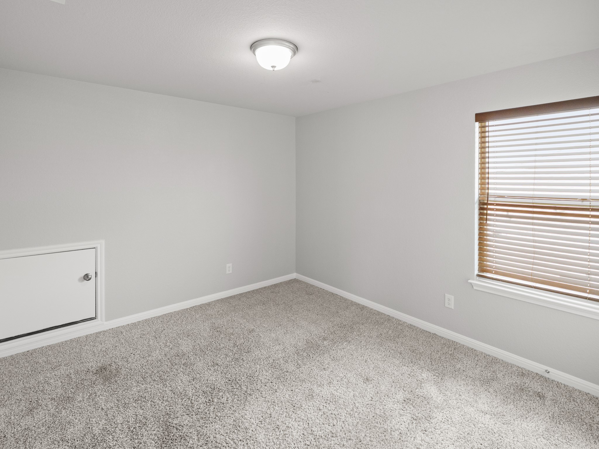 108 Drifter Lane Jarrell, TX 76537 - Photo 5 of 6 Carpeted room with light grey walls