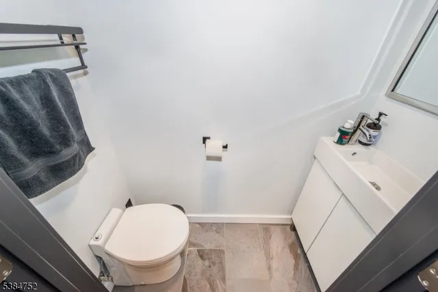 a bathroom with a toilet and a sink