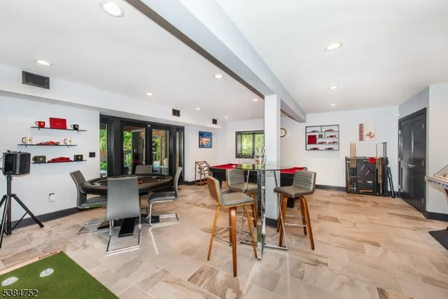 a living room with furniture and white walls