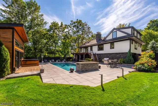 a view of a house with a yard patio and sitting area